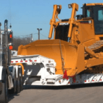Trusted heavy machinery transport, ensuring your excavator arrives on-site securely and on time for construction projects.